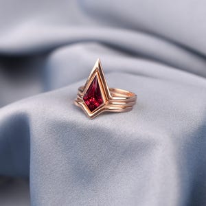 Unique red ruby stackable ring with sculptural three-band design, rose gold plated sterling silver jewelry for women