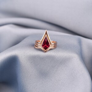 Unique red ruby stackable ring with sculptural three-band design, rose gold plated sterling silver jewelry for women