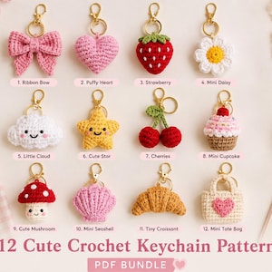 May include: A collection of 12 crochet keychains featuring various shapes including a pink bow, heart, strawberry, daisy, cloud, star, cherries, cupcake, mushroom, seashell, croissant, and tote bag, each attached to a gold-toned metal lobster clasp.