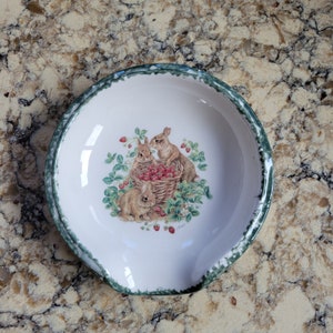 Rabbits and strawberries motif ceramic scoop style spoon rest with hand sponged green trim