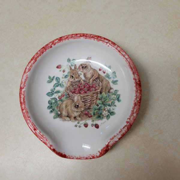 Rabbit and strawberries motif scoop style ceramic spoon rest with hand sponged red trim