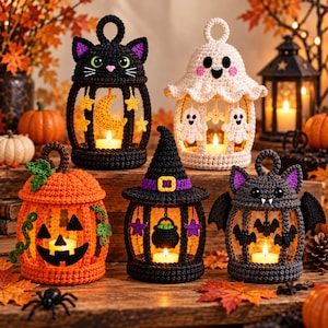 May include: Five crocheted Halloween lanterns featuring a black cat, a white ghost, an orange pumpkin, a witch hat with a cauldron, and a grey bat. Each lantern has a hanging loop, intricate yarn details, and a small glowing candle inside.