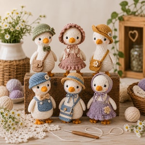 May include: Six crocheted duck dolls with white bodies and orange beaks, each wearing unique outfits including hats, dresses, overalls, and small bags in shades of green, pink, yellow, blue, and purple, arranged on a wooden block.