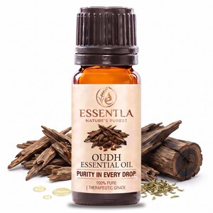 May include: A small amber glass bottle of Essentla Oudh essential oil with a black ribbed cap. The label features the text Essentla Nature's Purest, Oudh Essential Oil, Purity In Every Drop, and 100% Pure Therapeutic Grade with wood chip imagery.