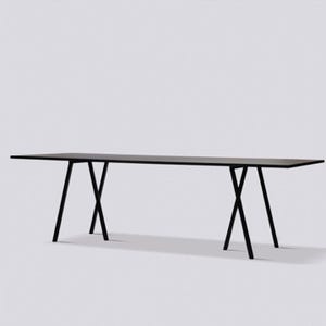May include: A long, rectangular black table featuring a flat, thin tabletop surface supported by two sets of crossed, angled black metal legs positioned at each end of the structure, creating a stable base for the elongated horizontal top.