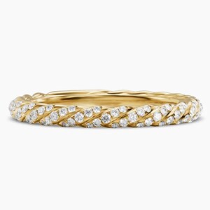 May include: A yellow gold ring featuring a twisted rope design. The band is encrusted with numerous small, clear, round-cut stones that follow the spiral pattern of the metal, creating a continuous sparkling effect around the entire circumference.