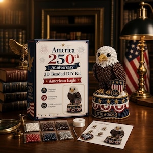 May include: A 3D beaded DIY kit for an American Eagle, featuring a box labeled America 250th Anniversary, a completed beaded eagle figurine on a circular base, six small bags of colored beads, a spool of thread, and an instruction sheet.