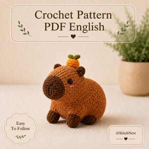 May include: A crochet pattern PDF in English featuring a brown capybara amigurumi with a small orange fruit on its head. The text reads Crochet Pattern PDF English, Easy To Follow, and @StitchNest. The capybara has dark brown paws and snout.