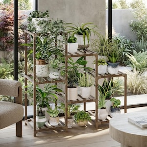 May include: A multi-tiered wooden plant stand featuring a grid-like frame with various potted plants arranged on its shelves. The stand holds a collection of green foliage, including ferns, succulents, and leafy plants in assorted ceramic pots.