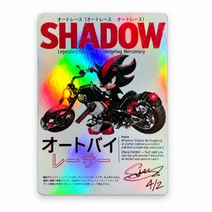 May include: A rectangular holographic trading card featuring a black hedgehog character riding a black motorcycle. The card displays the text SHADOW, Legendary Creature - Hedgehog Mercenary, and Japanese characters. It includes game rules, a signature, and 4/2.