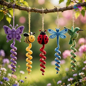 May include: Five crocheted hanging ornaments featuring a purple butterfly, a yellow and black bee, a red and black ladybug, a blue dragonfly, and a green hummingbird. Each figure is attached to a spiraling tail with wooden beads hanging from twine.