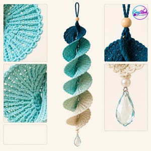 May include: A spiral crochet hanging ornament featuring a gradient of colours from dark blue to light beige. The piece includes a wooden bead at the top, a loop for hanging, and a clear teardrop-shaped crystal pendant at the bottom. Text reads Easy Hook.