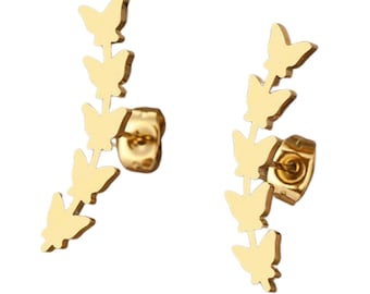 May include: A pair of gold butterfly earrings with a line of butterflies cascading down the earlobe. The earrings are made of stainless steel and have a post back.