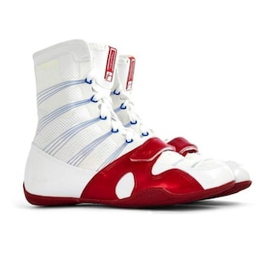 May include: A high-top boxing shoe in white with a red metallic overlay across the forefoot and sole. The shoe features white laces, blue accent lines along the side, and a red tab on the tongue with the text HyperKO printed in white letters.