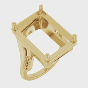 May include: A gold ring setting featuring a rectangular head with four prongs designed to hold a gemstone. The band has a smooth, polished finish and includes a small decorative accent with three tiny beads on each side of the ring shank.