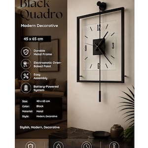 May include: A rectangular black metal wall clock measuring 40 x 65 cm. The clock features a clear face with black numerals at 12, 3, 6, and 9, black hands, and a vertical pendulum rod extending from the top mount to a cylindrical weight below.