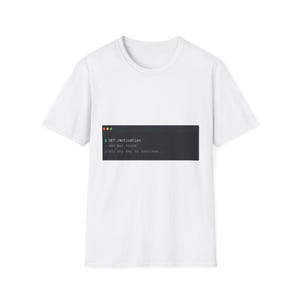 May include: A white short-sleeve t-shirt featuring a dark grey rectangular graphic on the chest. The graphic displays a terminal window with the text: $ GET /motivation, - 404 Not Found, press any key to continue, and three coloured dots.
