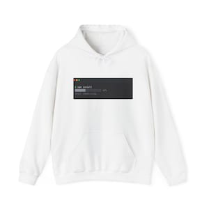 May include: A white hooded sweatshirt featuring a graphic of a dark gray terminal window on the chest. The graphic displays the text $ npm install, a progress bar at 42%, and the text still idealizing... with three colored dots at the top.