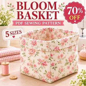 May include: A square fabric basket featuring a cream background with a pink and green floral print. The text on the image reads BLOOM BASKET, PDF SEWING PATTERN, 5 SIZES, and 70% OFF. The basket has a folded top edge and a structured shape.
