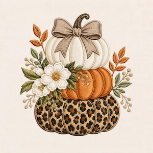 May include: An embroidery design featuring a stack of three pumpkins. The top pumpkin is cream-coloured with a beige bow, the middle is orange, and the bottom has a leopard print pattern. White flowers and orange and green foliage accent the sides.