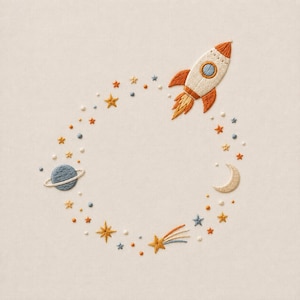 May include: An embroidery design featuring a circular arrangement of space elements on a light fabric. The pattern includes a rocket ship, a ringed planet, a crescent moon, a shooting star, and various small stars and dots in orange, blue, and cream.