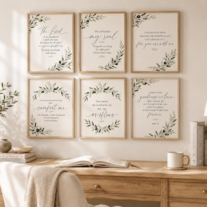 May include: A set of six rectangular wall art prints featuring black calligraphic text from Psalm 23, framed in light wood. Each print is decorated with green olive branch illustrations arranged in wreaths or corner accents on a white background.