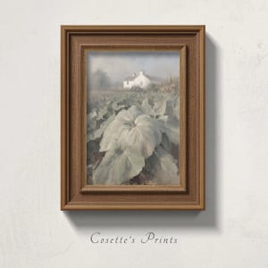 May include: A framed wall art print featuring a painting of a white house in a field with large green leaves in the foreground. The frame is made of brown wood with a textured finish. The text Cosette's Prints is visible below the frame.