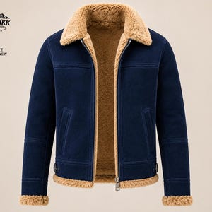 May include: A navy blue jacket featuring a tan faux shearling lining, a wide collar, and long sleeves. The jacket has a central metal zipper closure, two side pockets, and adjustable side straps at the hem. The cuffs and hem are trimmed in tan fur.