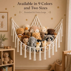 May include: A white macrame toy hammock with decorative tassels, filled with a variety of plush stuffed animals including bears, an elephant, a penguin, and a raccoon. The wall above features text stating Available in 9 Colors and Two Sizes.