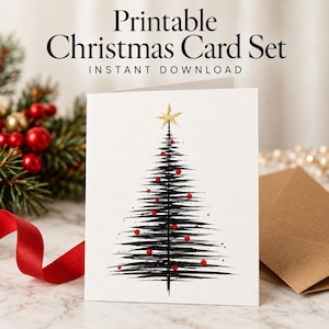Pode incluir: Um cartão de felicitações branco com uma árvore de Natal estilizada feita com pinceladas pretas, uma estrela dourada no topo e pequenos ornamentos circulares vermelhos. O texto Printable Christmas Card Set e INSTANT DOWNLOAD está acima.