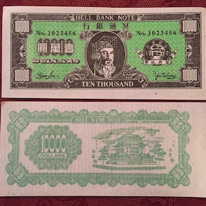 May include: A green and black paper bank note with the text "Hell Bank Note" and "Ten Thousand Dollars" printed on it. The note features a portrait of a man with a beard and a crown. The note also has a seal with a building and the text "Yu Wong" printed on it.