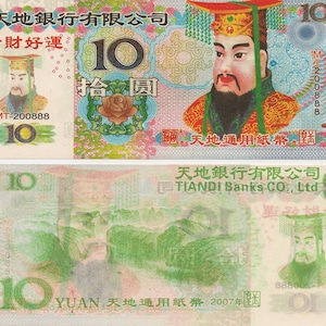 May include: A 10 Yuan banknote from the Tian Di Bank Co., Ltd. The front of the note features a portrait of a man in a red and gold robe with a crown. The back of the note features a landscape scene with mountains and a river.