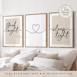 May include: A set of three framed wall art prints featuring black line art on a beige background. The left print displays the text Good night, the centre print shows a heart outline, and the right print displays the text sleep tight.
