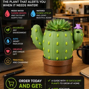 May include: A green cactus-shaped planter with yellow accents, featuring a succulent plant on top and a small purple flower on one arm. The planter sits in a brown pot and includes text explaining a smart water indicator system for plant care.