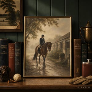 May include: A framed wall art print depicting a person riding a brown horse on a dirt path beside a stable in a misty, muted landscape. The artwork is displayed on a wooden shelf surrounded by vintage books, a golf ball, and a trophy.