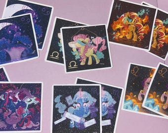 May include: A collection of square stickers featuring colorful pony illustrations inspired by zodiac signs. Each sticker displays a unique character against a dark, starry background with specific astrological symbols like Cancer, Libra, Gemini, and Leo.