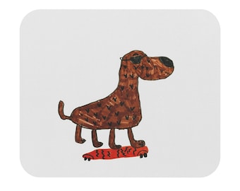 May include: A rectangular mouse pad featuring a hand-drawn illustration of a brown dog with dark spots and black sunglasses standing on a red skateboard with black zigzag patterns. The background of the mouse pad is a solid, plain white color.