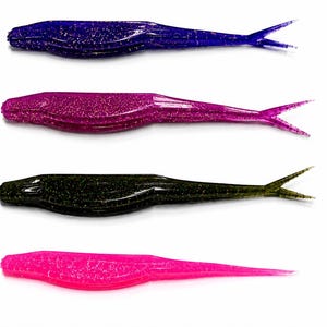May include: Four soft plastic fishing lures arranged horizontally. The top lure is dark blue with glitter, the second is magenta with glitter, the third is dark green with glitter, and the bottom lure is a solid bright neon pink color.