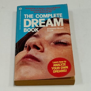 May include: A paperback book titled The Complete Dream Book by Edward Frank Allen. The cover features a close-up of a person sleeping, with blue text at the top and a red circular badge in the bottom right corner that reads Learn how to ANALYZE YOUR OWN DREAMS!