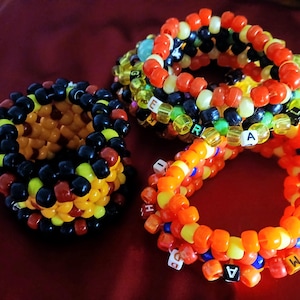 Xtra Small | Red Cuff Kandi Bracelets | Kai Satou from YTTD, Red Son from Lego Monkey Kid, & Mao Mao from Heroes of Pure Heart Spinners