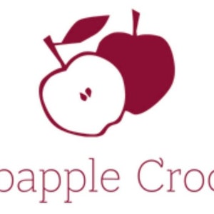 May include: A logo for a business called "Crabapple Crochet" featuring two red apples, one with a leaf and one with a slice cut out.