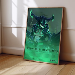 May include: A framed poster featuring a dark, jagged creature with glowing green accents and sharp teeth. The text reads OUTWORLD DESTROYER THE HARBINGER, followed by descriptive lore text and small circular icons at the bottom on a green background.