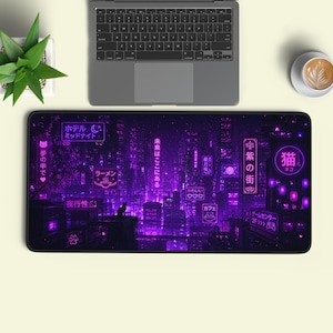 May include: A rectangular desk mat featuring a vibrant purple cyberpunk cityscape illustration with Japanese text, neon signs, and a silhouette of a cat. The design includes glowing kanji, a ramen bowl icon, and various urban building structures.