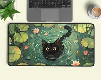 May include: A rectangular desk mat featuring a black cat swimming in a pond filled with green lily pads and pink lotus flowers. The illustration shows the cat's head and tail above the water, surrounded by ripples, set against a dark green background.
