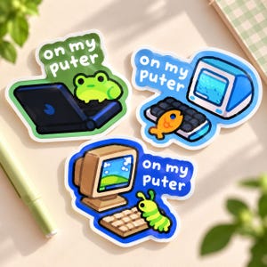 May include: Three die-cut stickers featuring computers and animals with the text on my puter. One shows a green frog on a laptop, another a blue computer with a goldfish on a keyboard, and the third a beige computer with a green caterpillar on a keyboard.