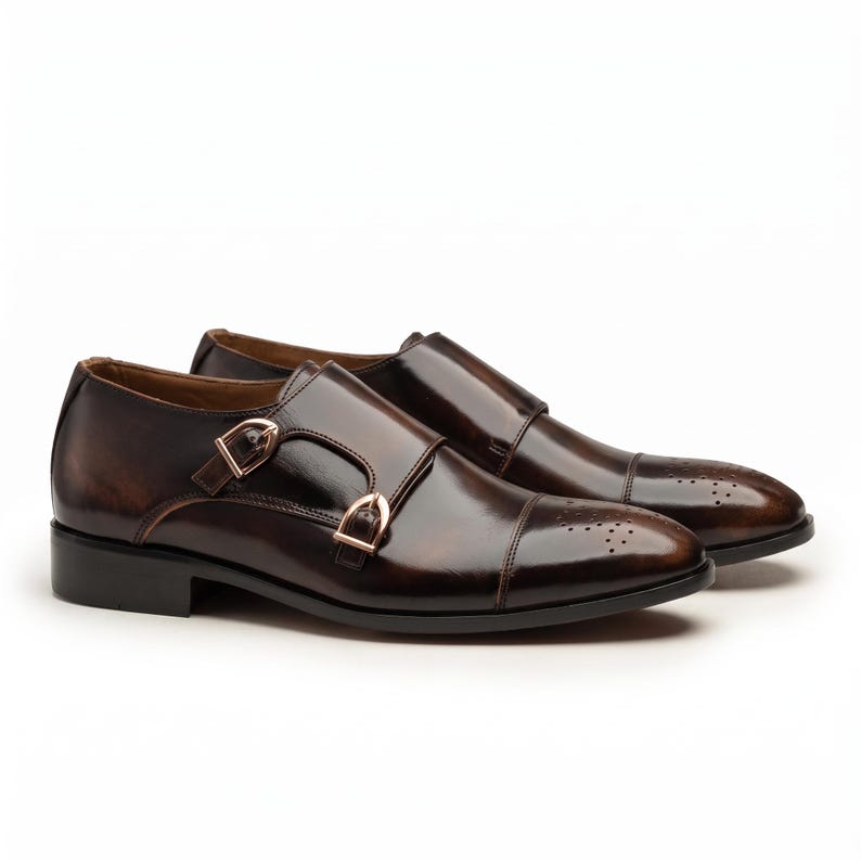 Hand painted dark brown double monk strap dress shoes for men with cap toe detail, front view
