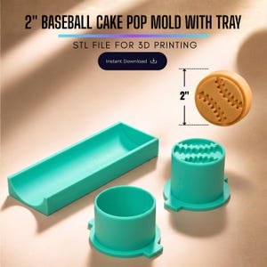 May include: A 2-inch baseball cake pop mold set including a teal rectangular tray and two cylindrical teal mold pieces. The text 2" BASEBALL CAKE POP MOLD WITH TRAY and STL FILE FOR 3D PRINTING is visible. A tan baseball-shaped cake pop is shown.