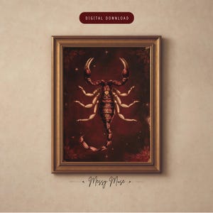 May include: A framed digital download print featuring a dark red background with a central scorpion illustration. The scorpion has intricate patterns on its body and a small gold heart shape. The text "DIGITAL DOWNLOAD" appears at the top.