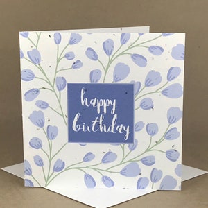 Pflanzenfreundliche Saatkarte / Happy Birthday Wand aus lila Blumen