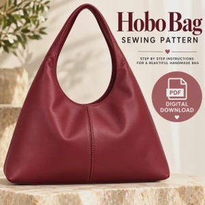 May include: A deep red hobo bag with a single shoulder strap and a central vertical seam. The text reads Hobo Bag SEWING PATTERN, STEP BY STEP INSTRUCTIONS FOR A BEAUTIFUL HANDMADE BAG, and PDF DIGITAL DOWNLOAD with a heart icon.